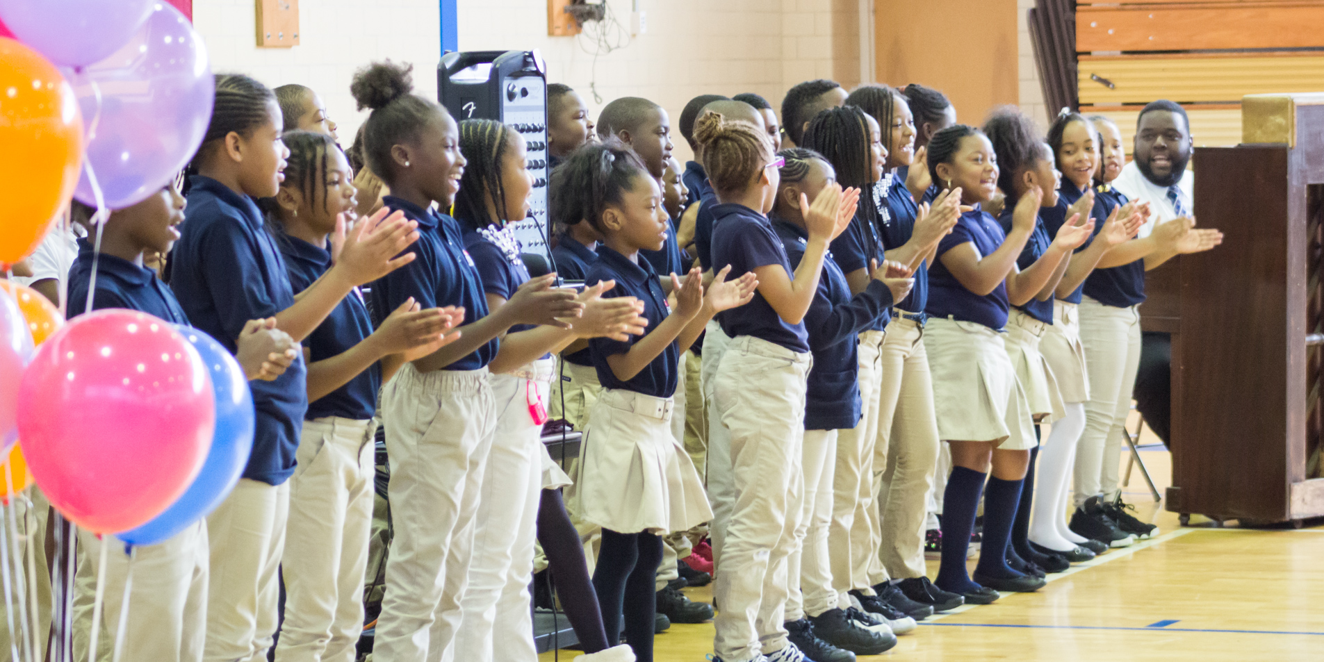 Students in a line clapping