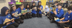 Group of students reading books.