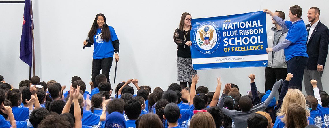 Photo of students, principal, nad board members at the National Blue Ribbon celebration ceremony